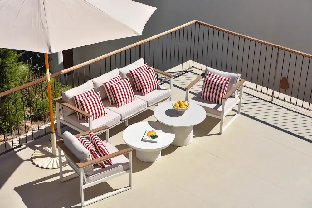 White sofa with a tea table on a terrace